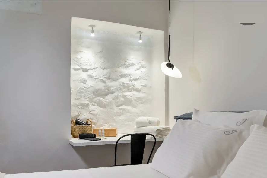 Stone alcove white linens nook — Suite Aurelia at Syra di Giovanni 1862, Ermoupoli, Syros