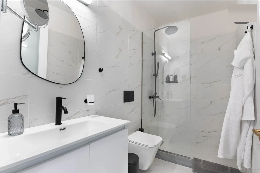 Aurelia marble bathroom with a walk-in rain shower